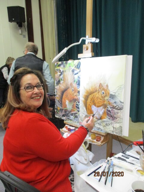 Angel Gaughan painting a squirrel