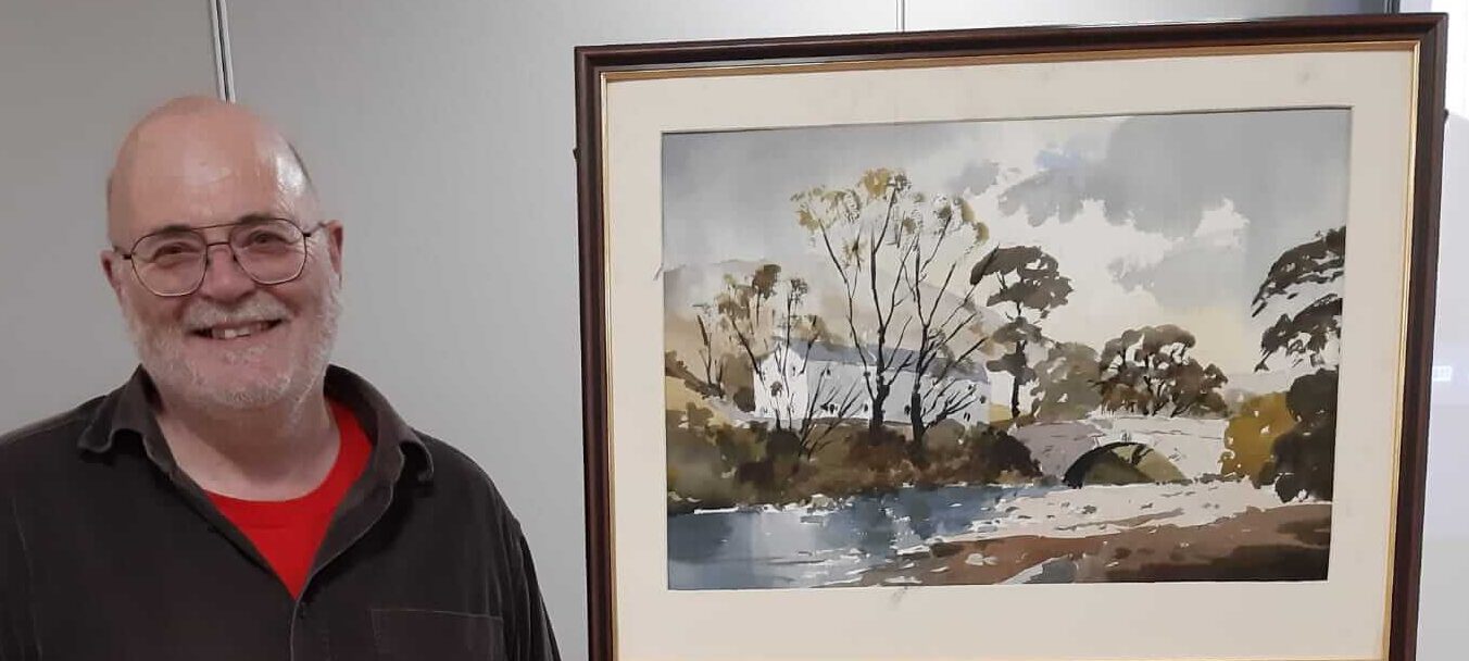 Artist Phil Biggs next to demonstration piece